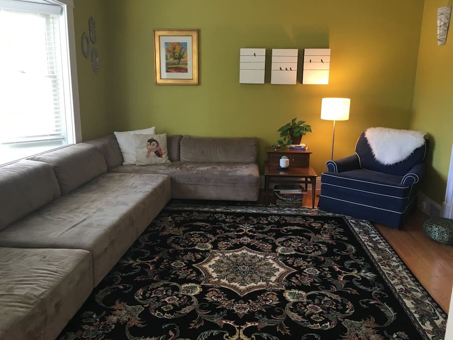 The living room standing in the entry way.