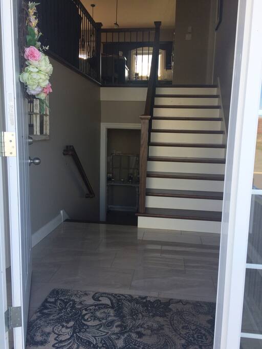 Airbnb apartment down the stairs to the left, main floor living space up the stairs.