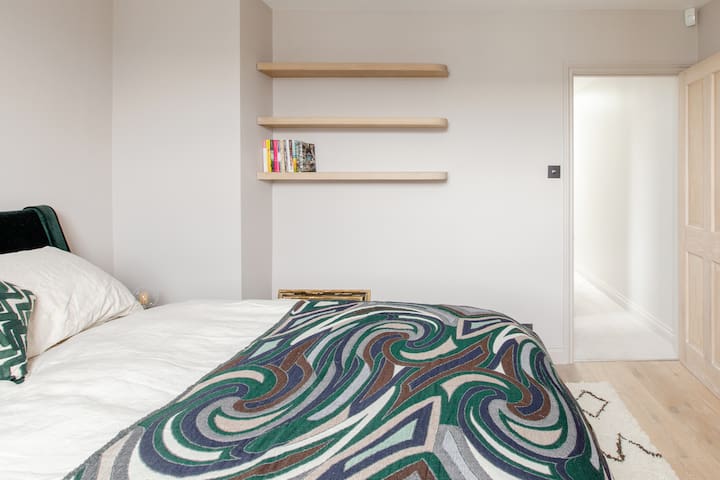 Chill in the Sleek Teal and Marble Kitchen at a Period Pad gallery image 3