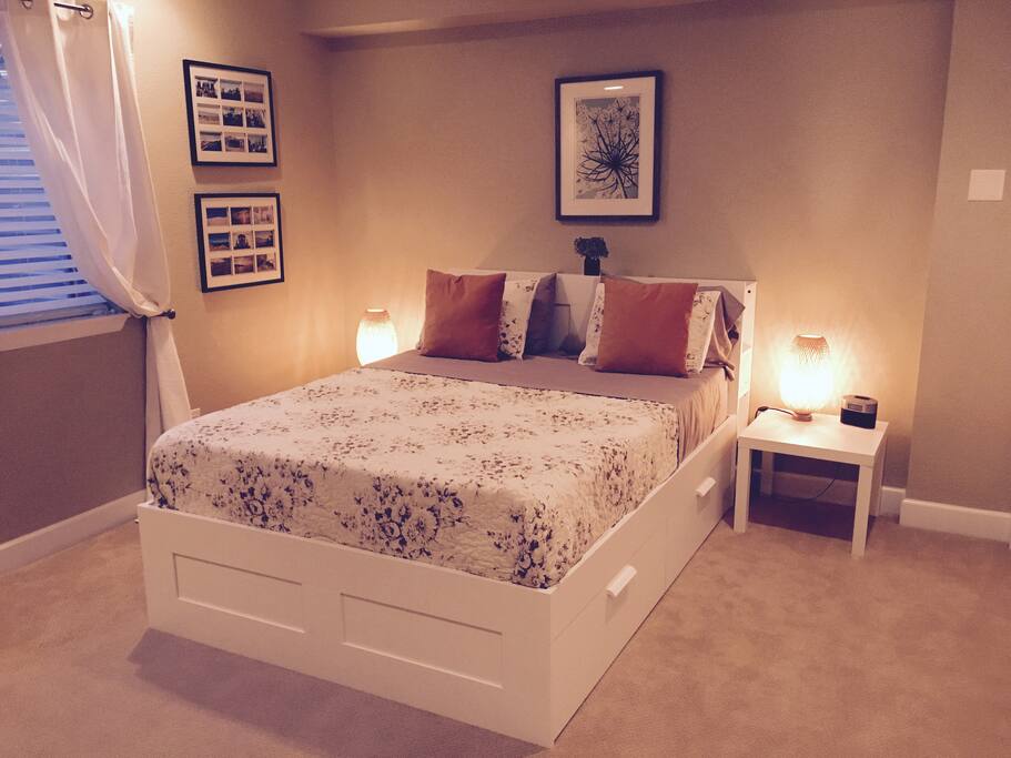 This basement apartment has two bedrooms. Basement Bedroom 1 -- Queen-sized bed (with memory foam mattress) with TV and laptop/work area.