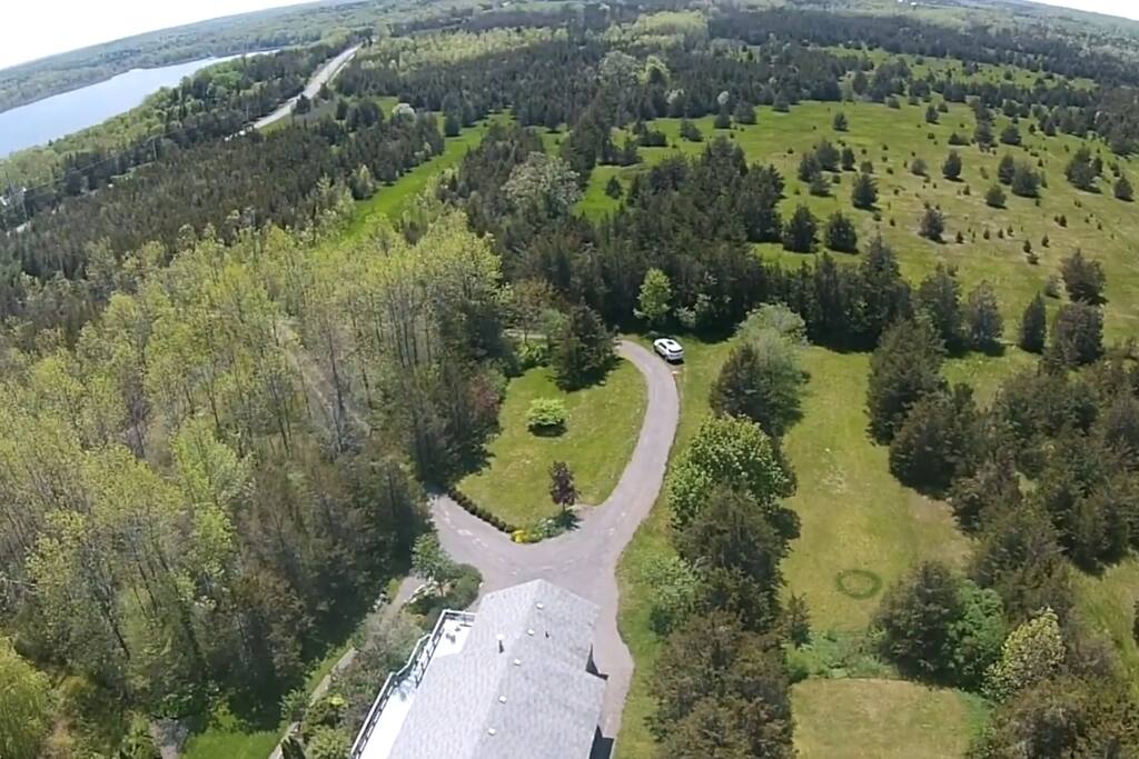 Aerial view which shows the proximity of the home to Lake Ontario