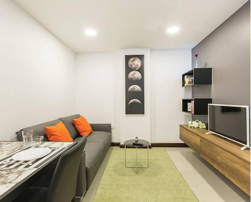Living area with a flat-screen TV.