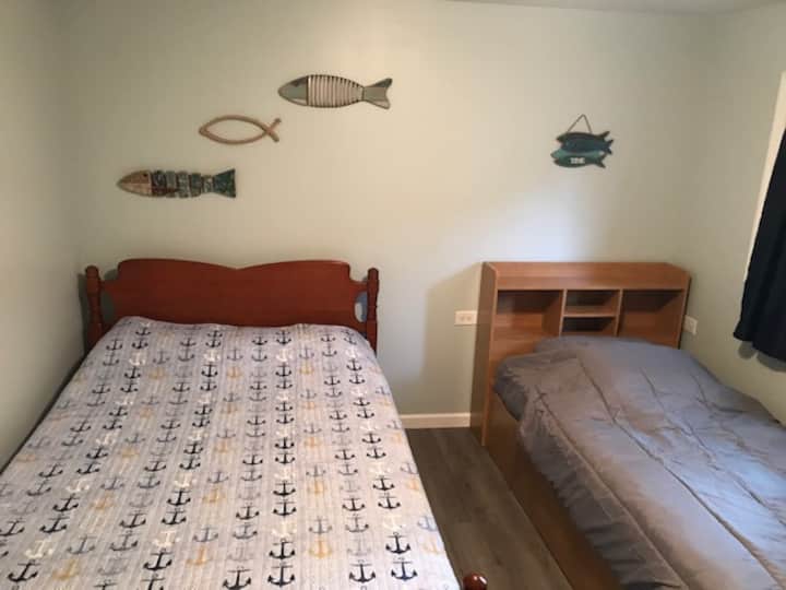 West bedroom with 1 double and 1 twin bed.