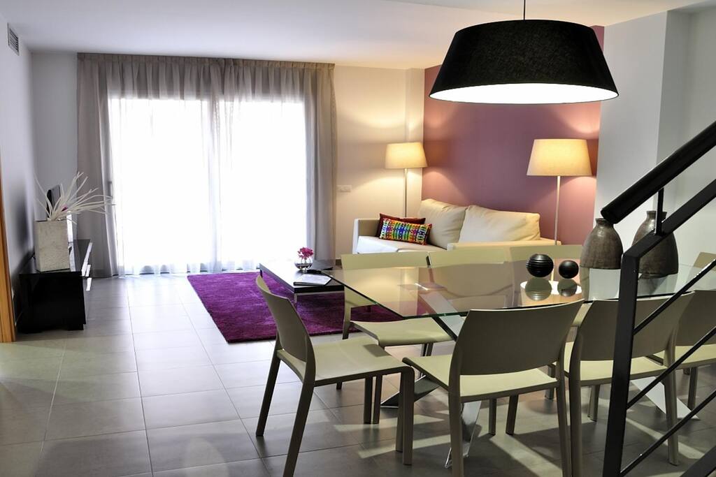 Enjoy having a cocktail or sharing a meal with your group at the gorgeous dining table.