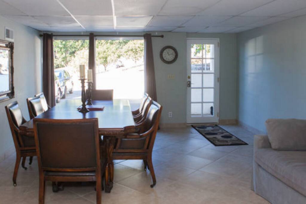 View of entrance and formal dining room, foldout couch is on the right