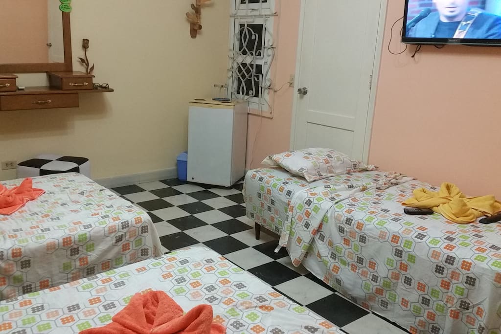 room with three big beds for friends and family.