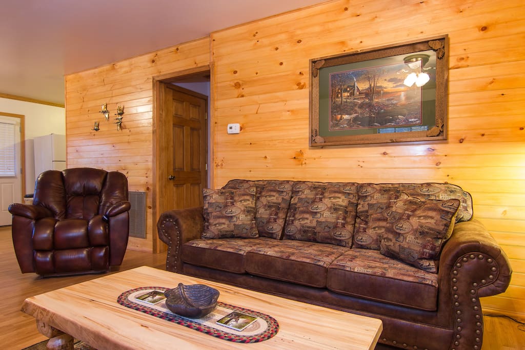 Living Room With A Pull Out Sofabed, Aspen Log Tables, And A Very Comfy Electric Leather Reclining Chair.
