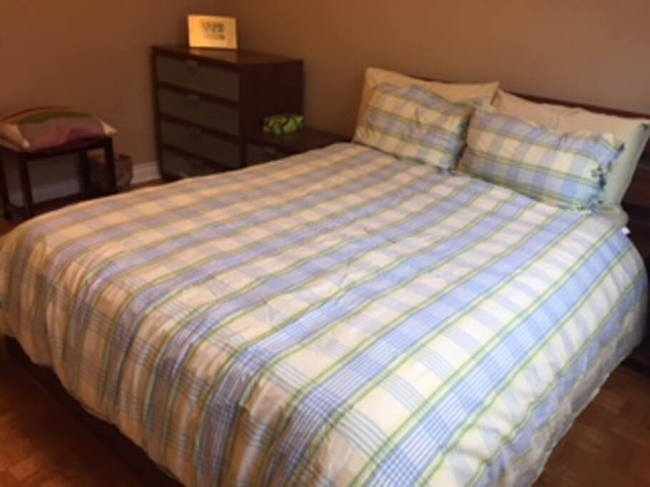 Bedroom 1 with comfortable full bed, wardrobe and dresser.