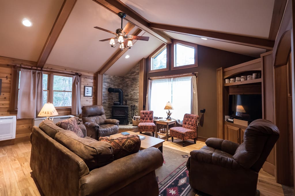 Living Room with wood stove and large TV/surround sound stereo system
