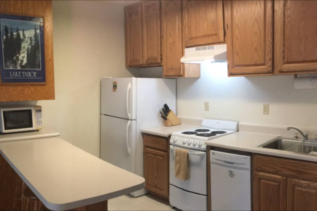 Full Kitchen with Compact Appliances and Counter Bar
