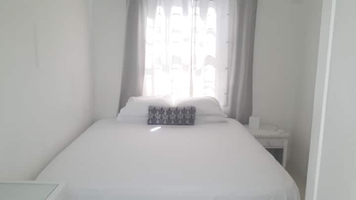 Furnished with a queen bed. 