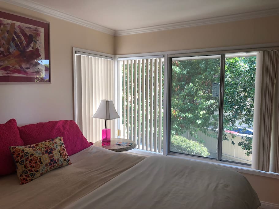 Master bedroom Suite #2 with walk in shower, overlooking park like setting, lovely landscaping. Morning or Evening walks are a joy, overlooking golf course and the mountains. Walk to grocery, dining, and services 1-2 blocks.