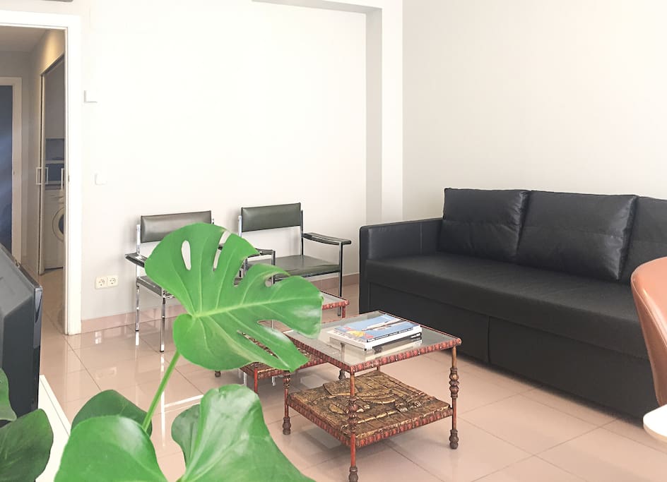 big living-room with sofa-bed and 70´s spanish design armchair