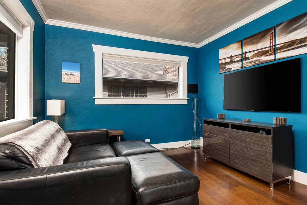 Movie night? Snuggle up on the leather loveseat.