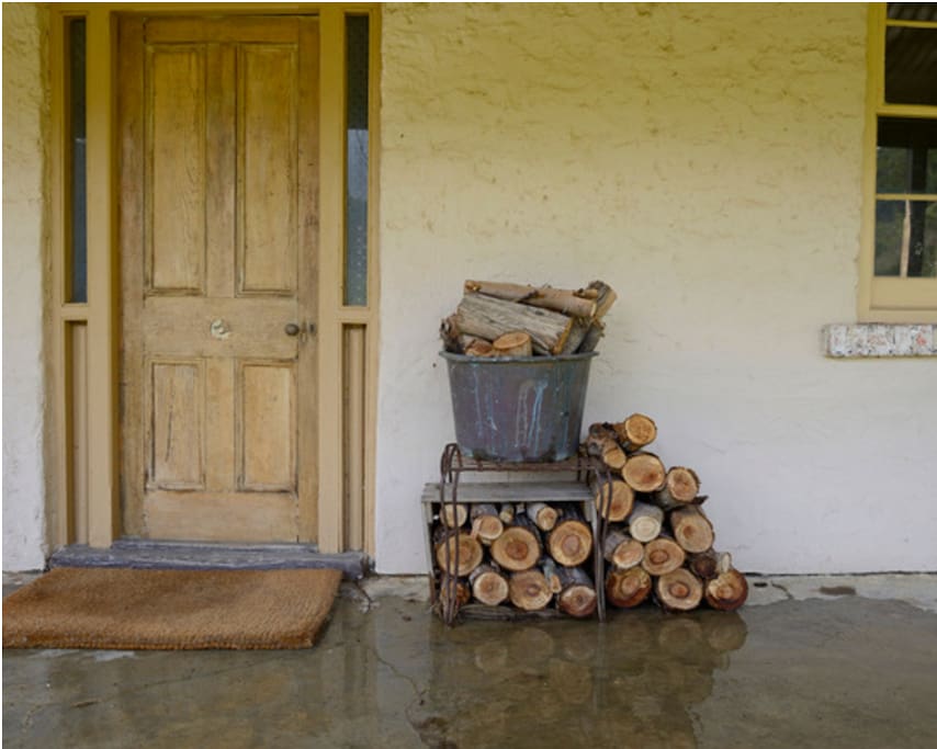 Front entrance with wood stacked for your open fire.