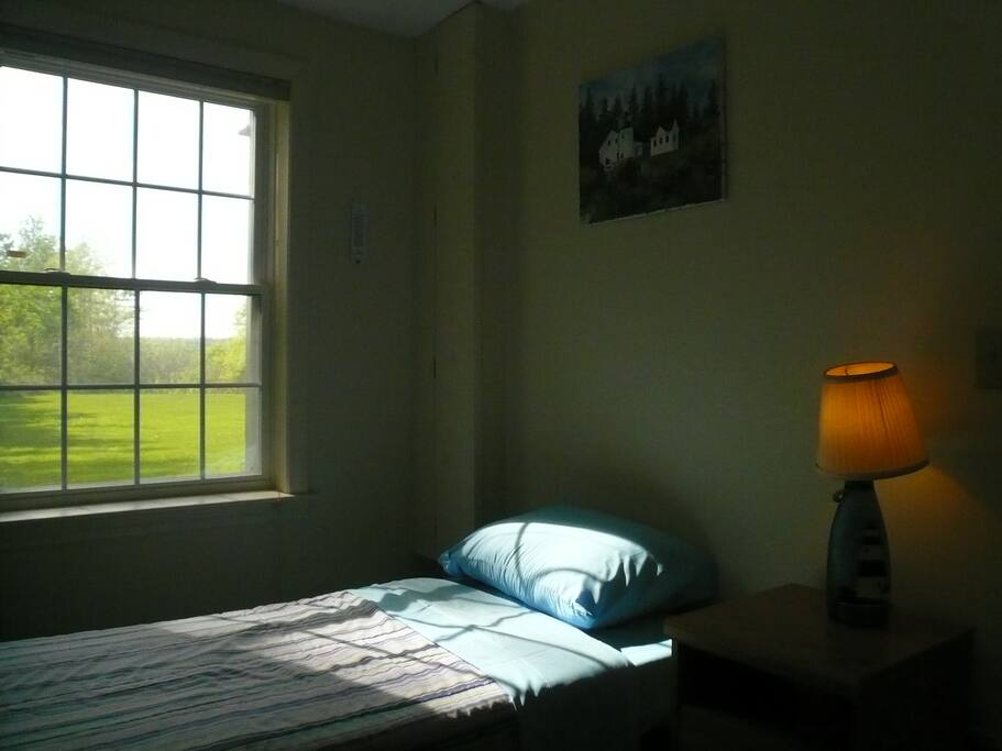 The smaller bedroom has a single bed, a reading nook and a large closet.