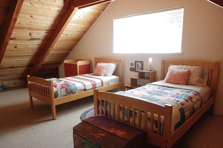 Upstairs loft. A queen bed and half bath is also located upstairs (not shown).