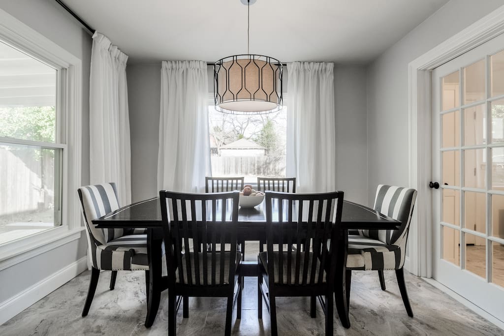 Spacious dining room that looks out over the back yard- we have extra chairs for groups of 8