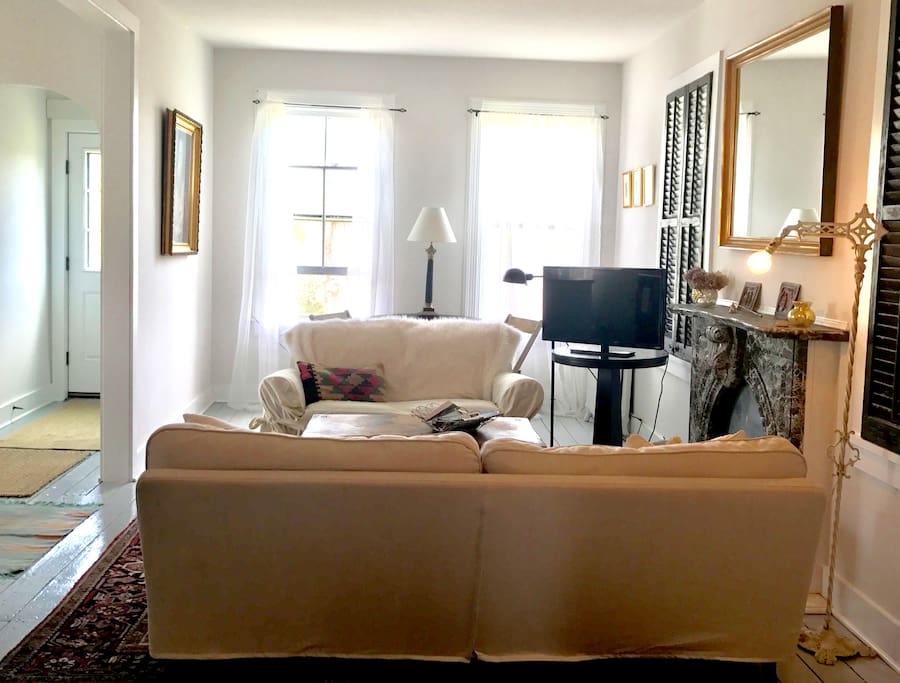 The living room is light filled and looks out onto the back garden.