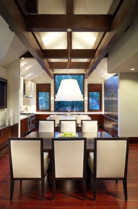 Dining/Kitchen in the Background. 4 more chairs are in the house for the dining room if needed.