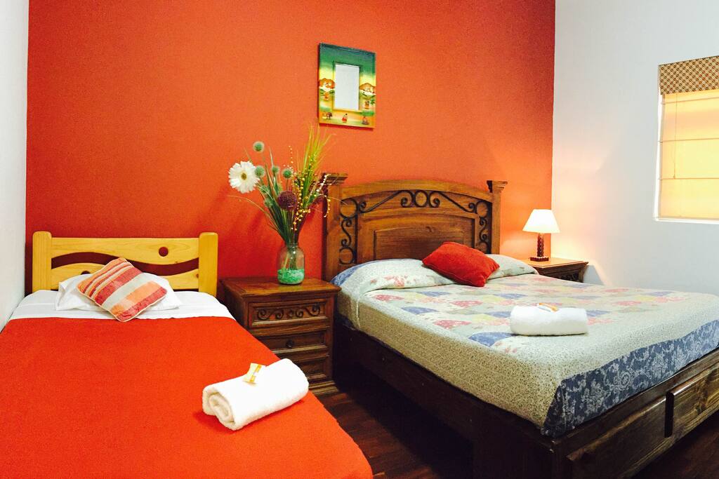 Room with full bed and extra bed