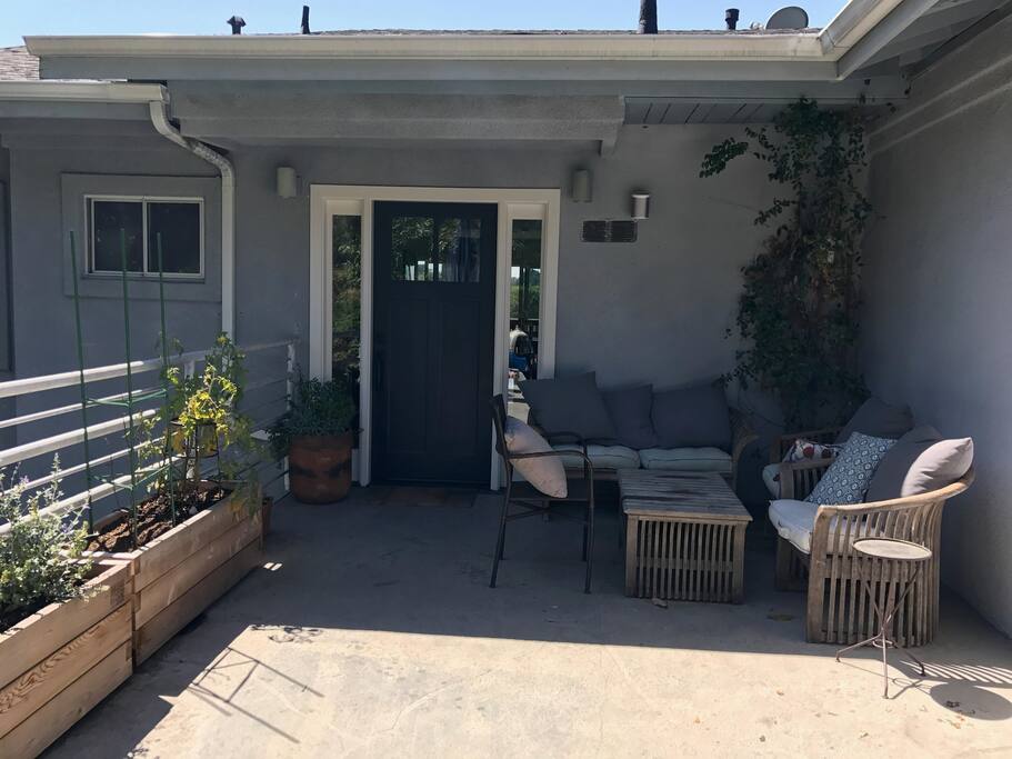 We recently painted and put in an outdoor area for sitting an having cocktails while the kids play.