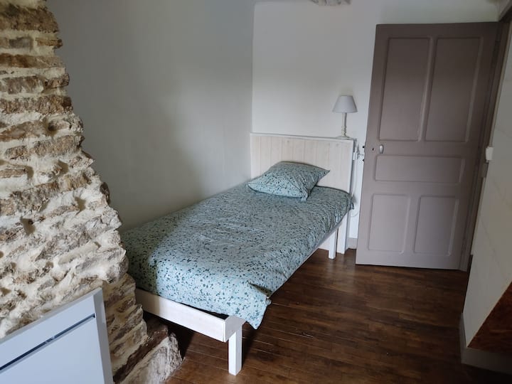 Bedroom with 2 single beds. The duvets are double layered, you can remove one if you're too hot.