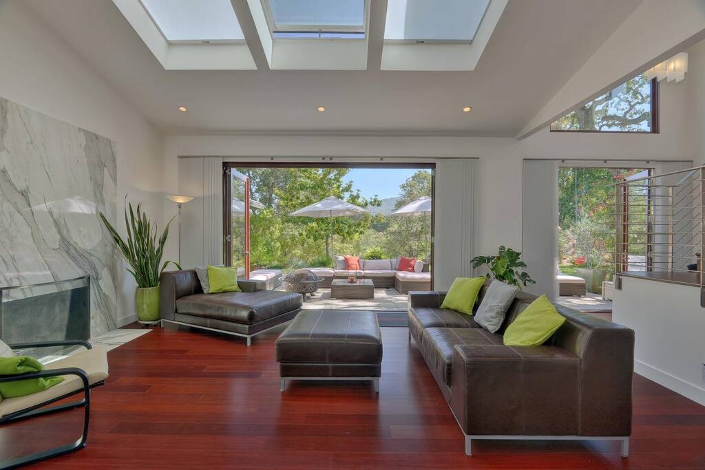 Large bifold door opens living room up to outdoor patio space