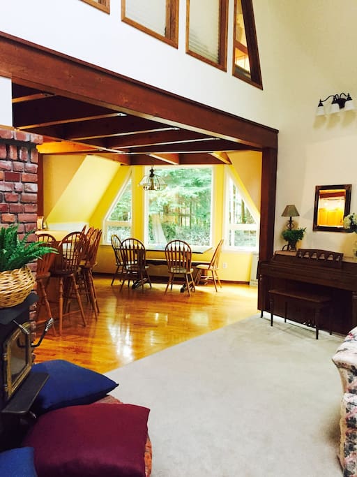 Dining with seating for 12 includes 6 Amish bar stools, piano for your entertainment.