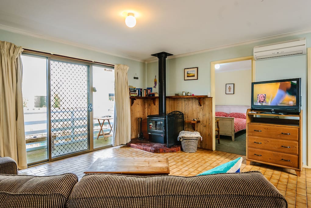 Open plan living area with wood heater...