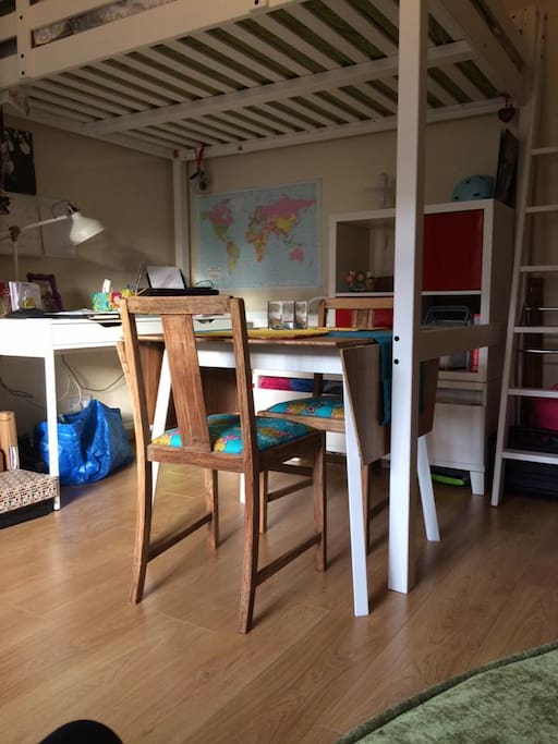 Dining and desk area underneath the double loft bed