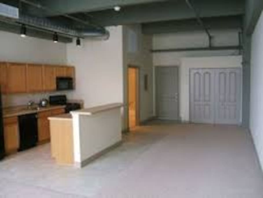 Matttress with box spring on floor.