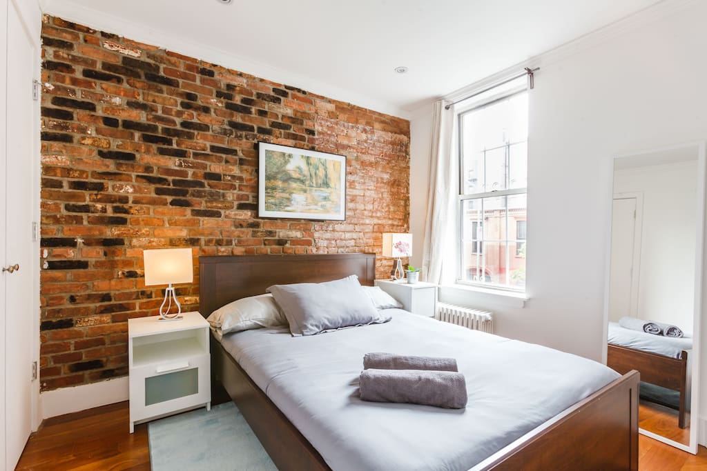 A large queen bed with great lighting. Great for two.