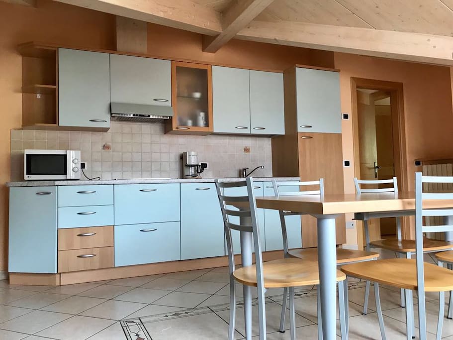 The kitchen and the dinning area.