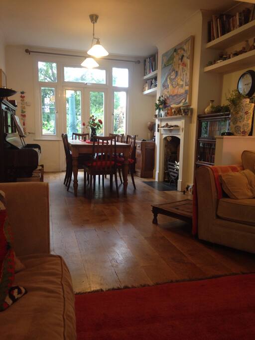 The dining room with desk and piano .