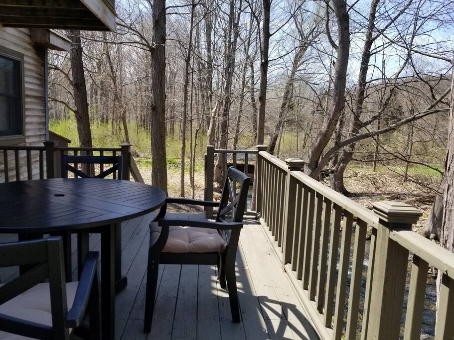 Back deck overlooking bridge and stream