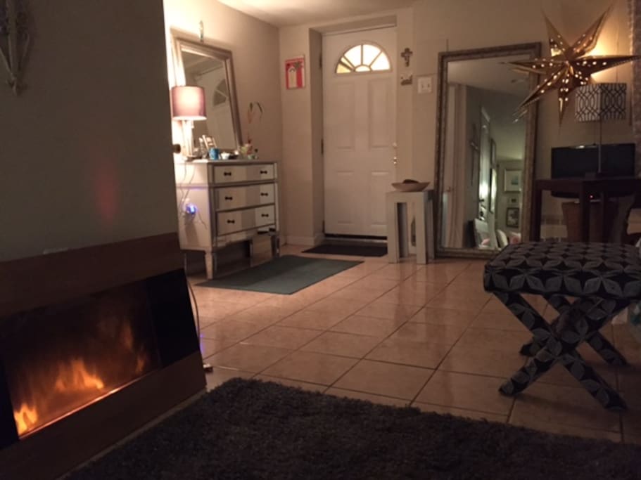 An electric fireplace (no heat) adds ambiance to a relaxing space.