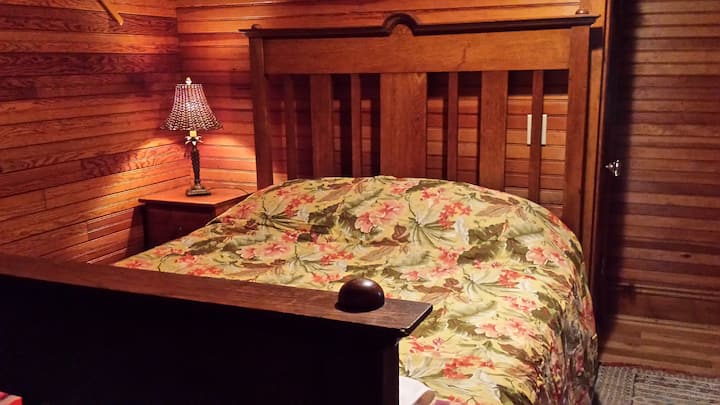 The downstairs bedroom. There are 2 storage closets with extra linens, vacuum, chairs and more.