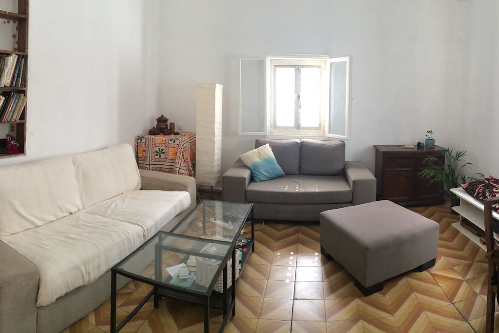 Living room also has a large dining table with 4 chairs