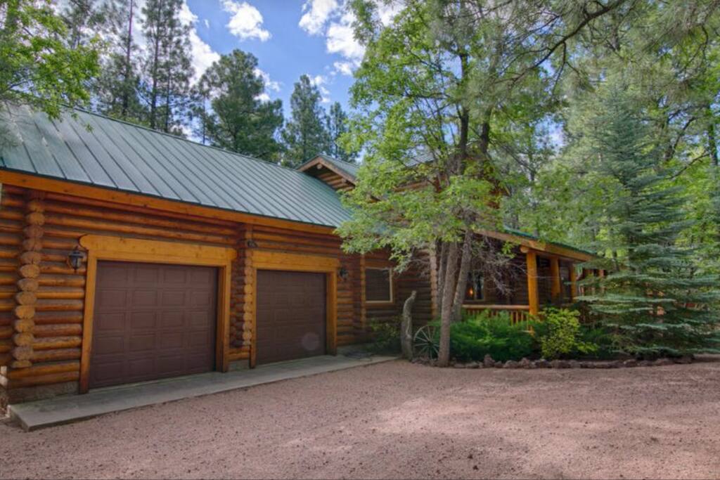 Front covered deck and two car garage