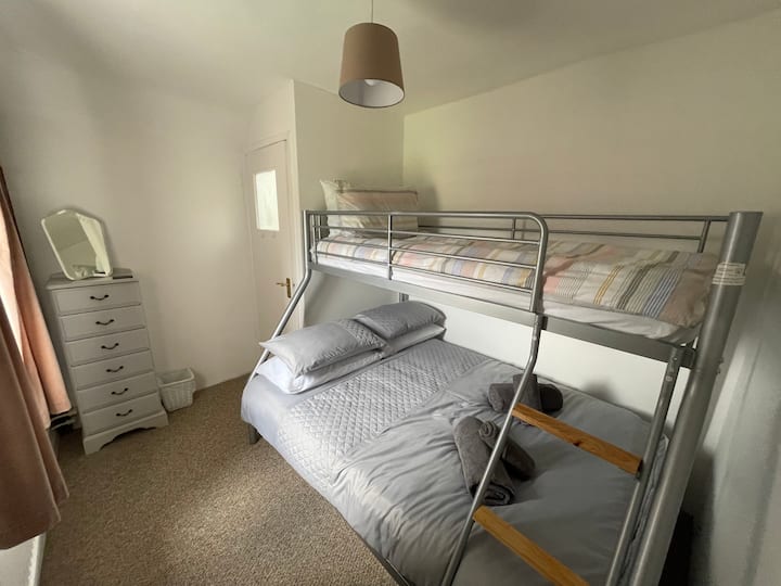 Bedroom with a double bed and a single on top 