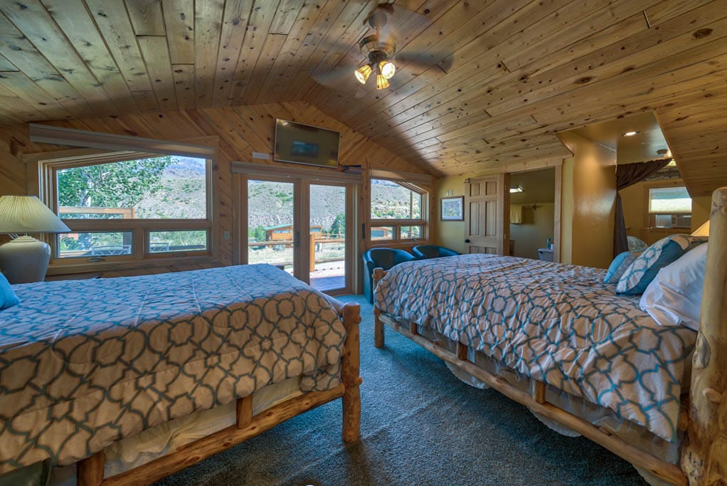 Bedroom 2-Upstairs room with private deck - 2 Queens, connected to 4 singles