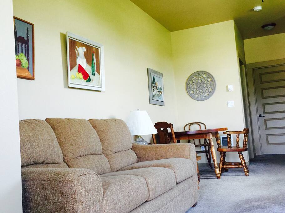 Brand new LaZboy fold out couch in living area.