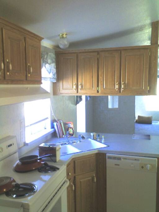 DINING BEYOND COUNTER, FAMILY ROOM BEYOND DINING