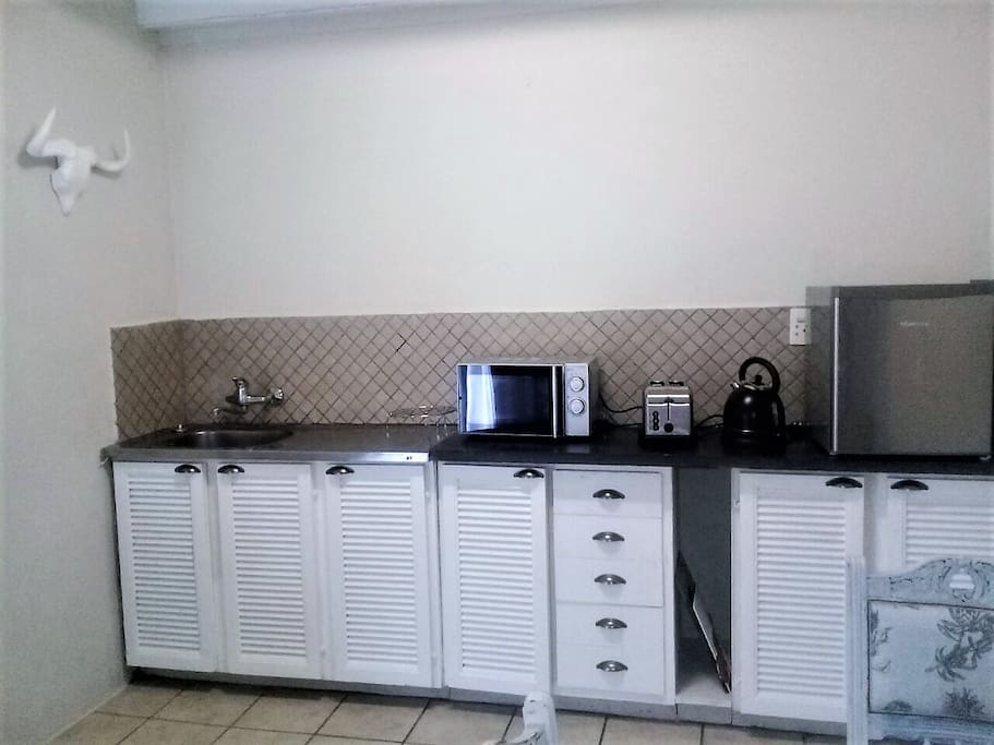 Duplex Cottage kitchenette with bar fridge, microwave,kettle & toaster.