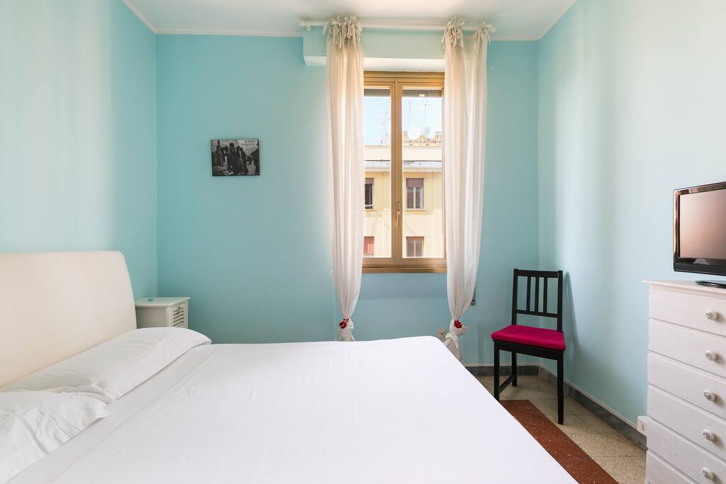 The Bedroom - The comfortable double bed with the TV
