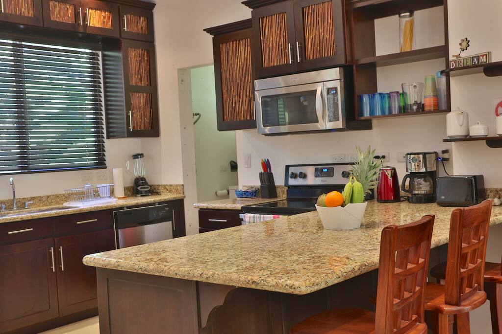Well equipped kitchen and island.