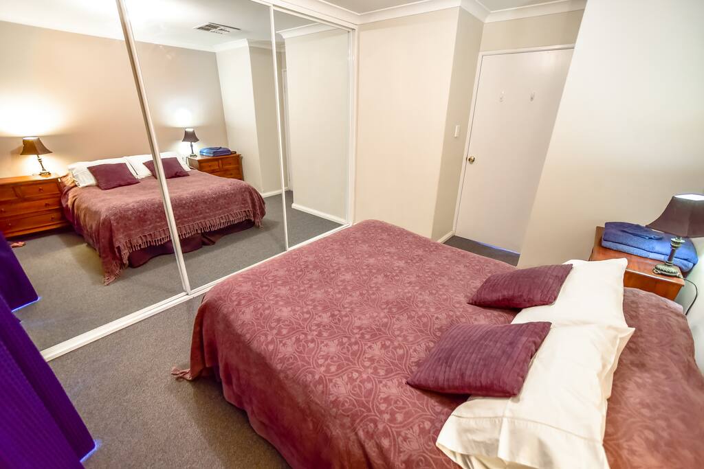 Comfortable Master Suite with Large Mirrored Robes