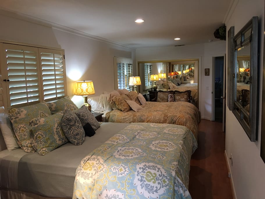 Two Cal King beds. Very comfy! Two mirrored closets in opposite walls.