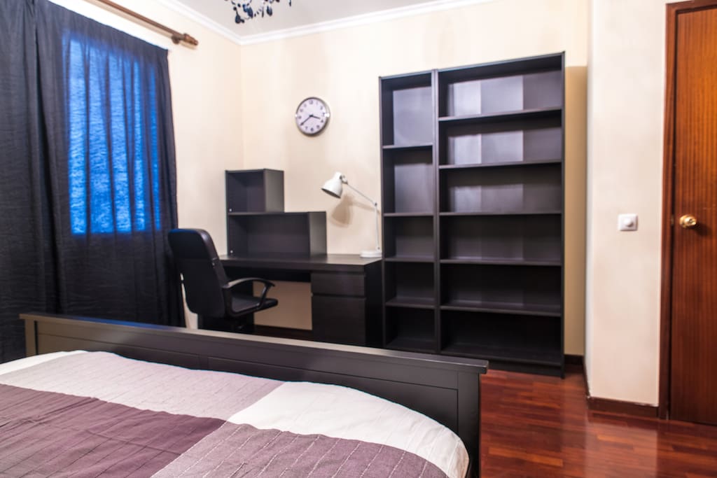 master bedroom with convenient work station and wireless-charing lamp